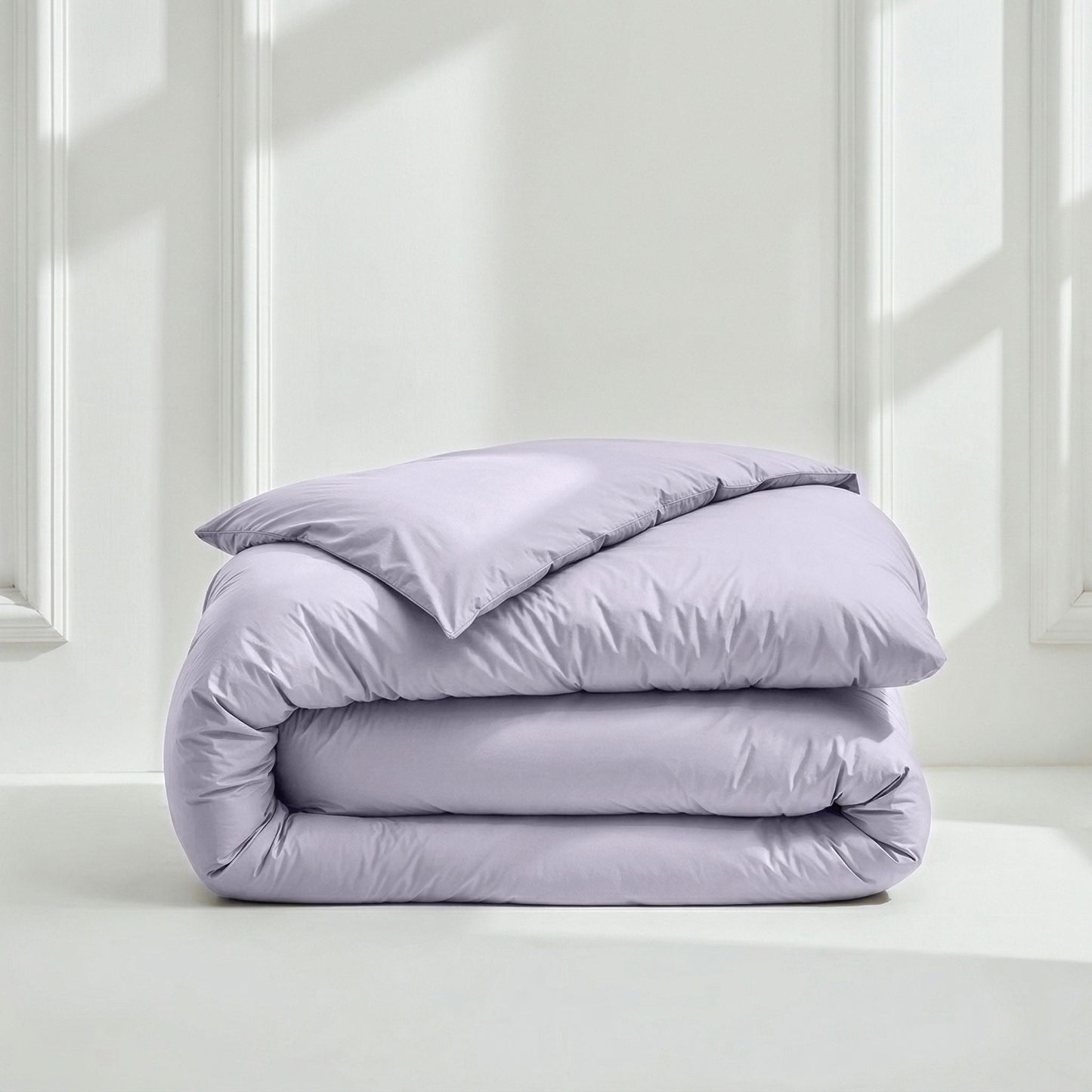 Lavender bedding set: folded duvet with matching pillow on top