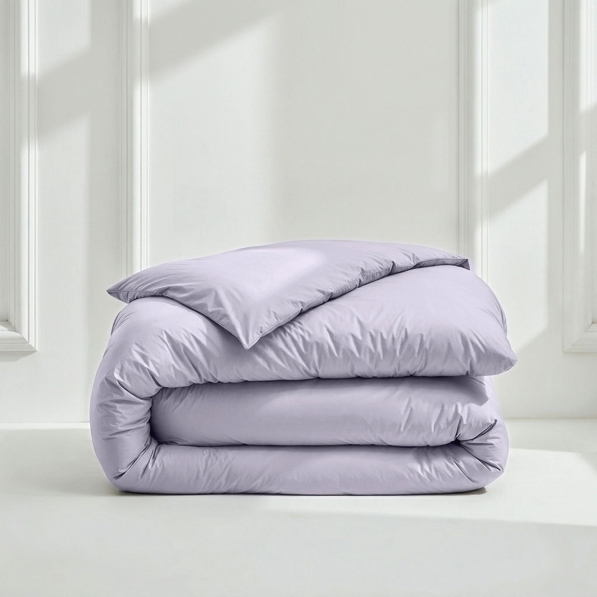 Lavender bedding set: folded duvet with matching pillow on top