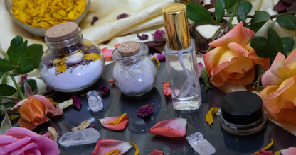 Pampering Positive Package gift set with bath oil bottles, jars, and rose petals