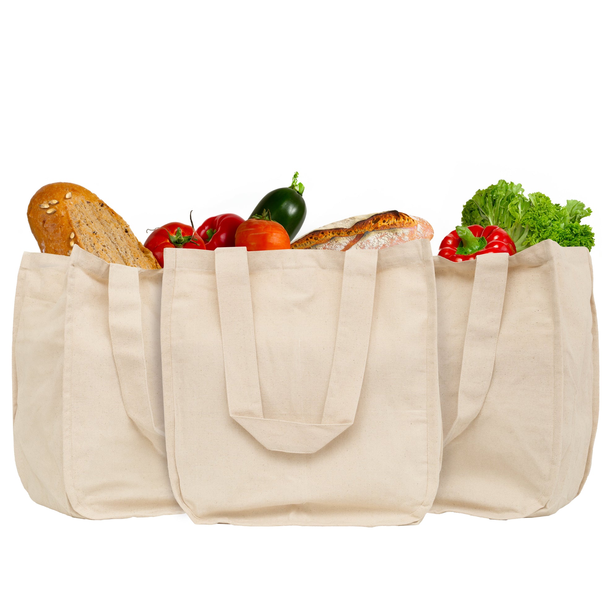 Canvas grocery tote bags, beige with side pockets holding bread and vegetables