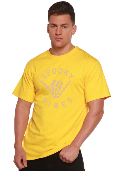 Men's graphic T-shirt in yellow with “SPOOKY VIBES” skeleton-hand design
