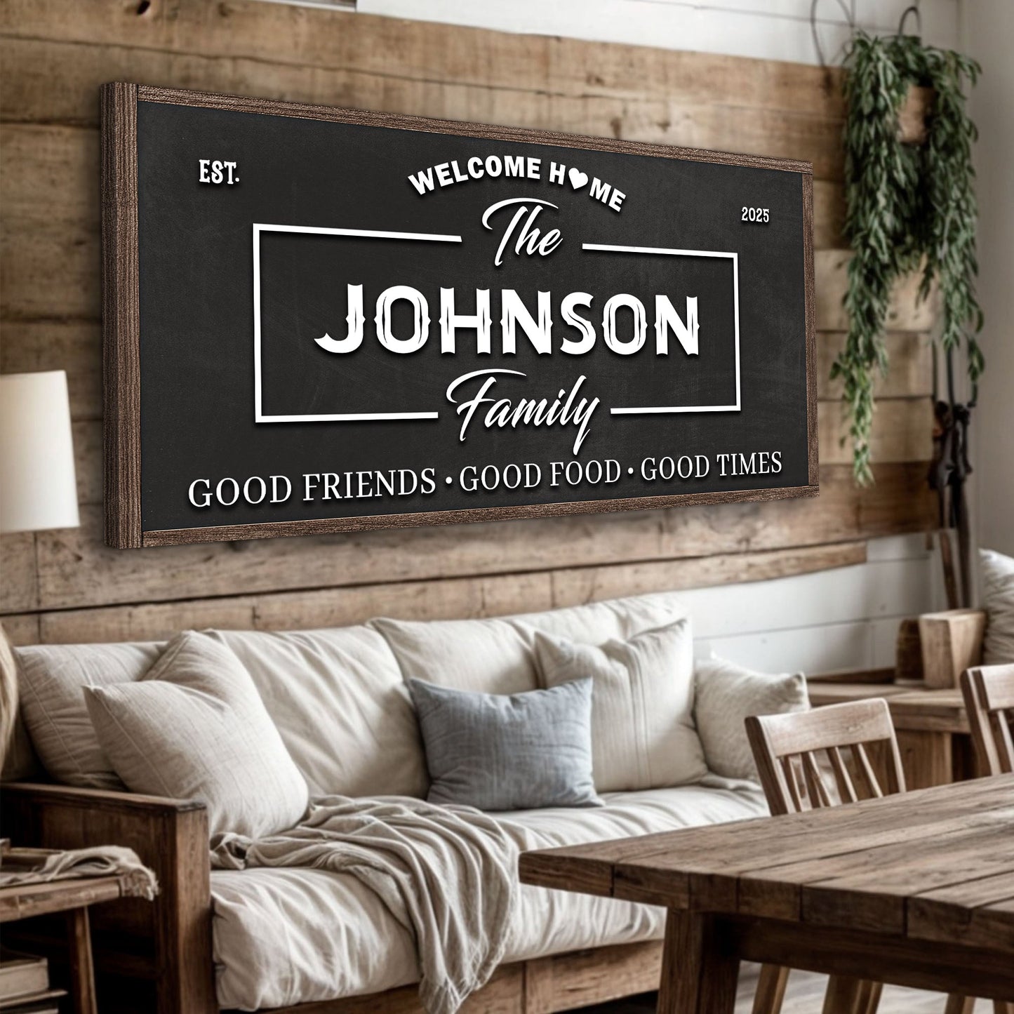 Hanging wall sign in a dark frame with “Welcome Home” and “The Johnson Family” text