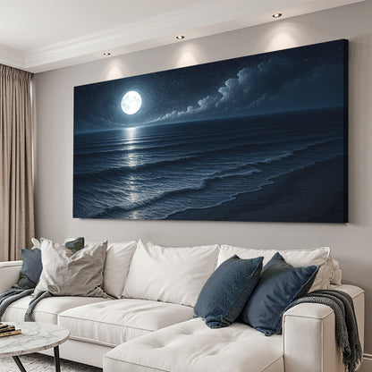 Coastal night ocean canvas wall art with moon and wave reflections above bed