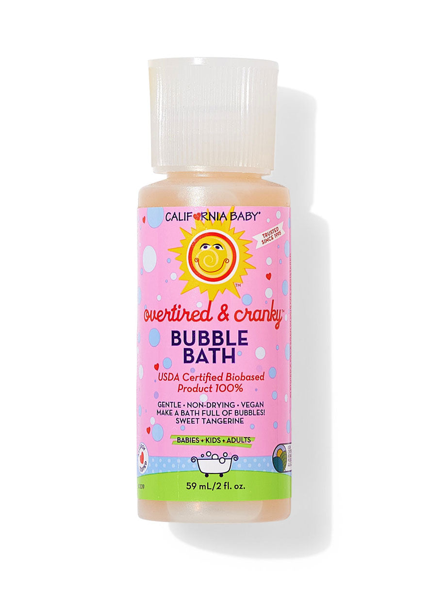 Bubble bath bottle with clear cap, pink label and green bottom band