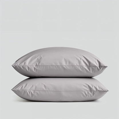 Sateen bedding bundle with two gray pillows stacked, showing smooth surface