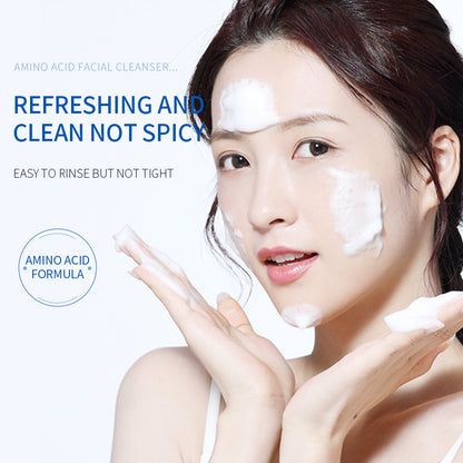 Amino acid facial cleanser with foam applied to face on a person.
