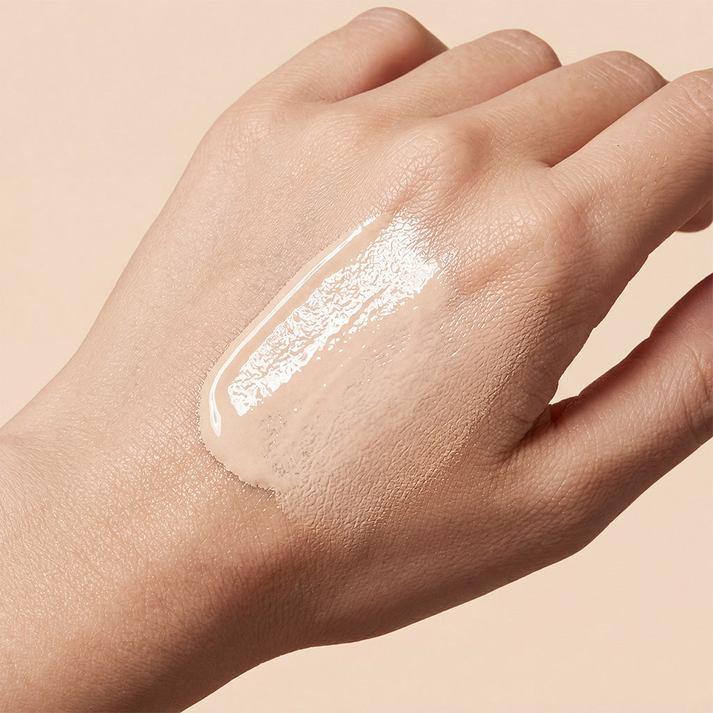 Zephoco color-changing sunscreen foundation swatch on hand, light cream glossy finish