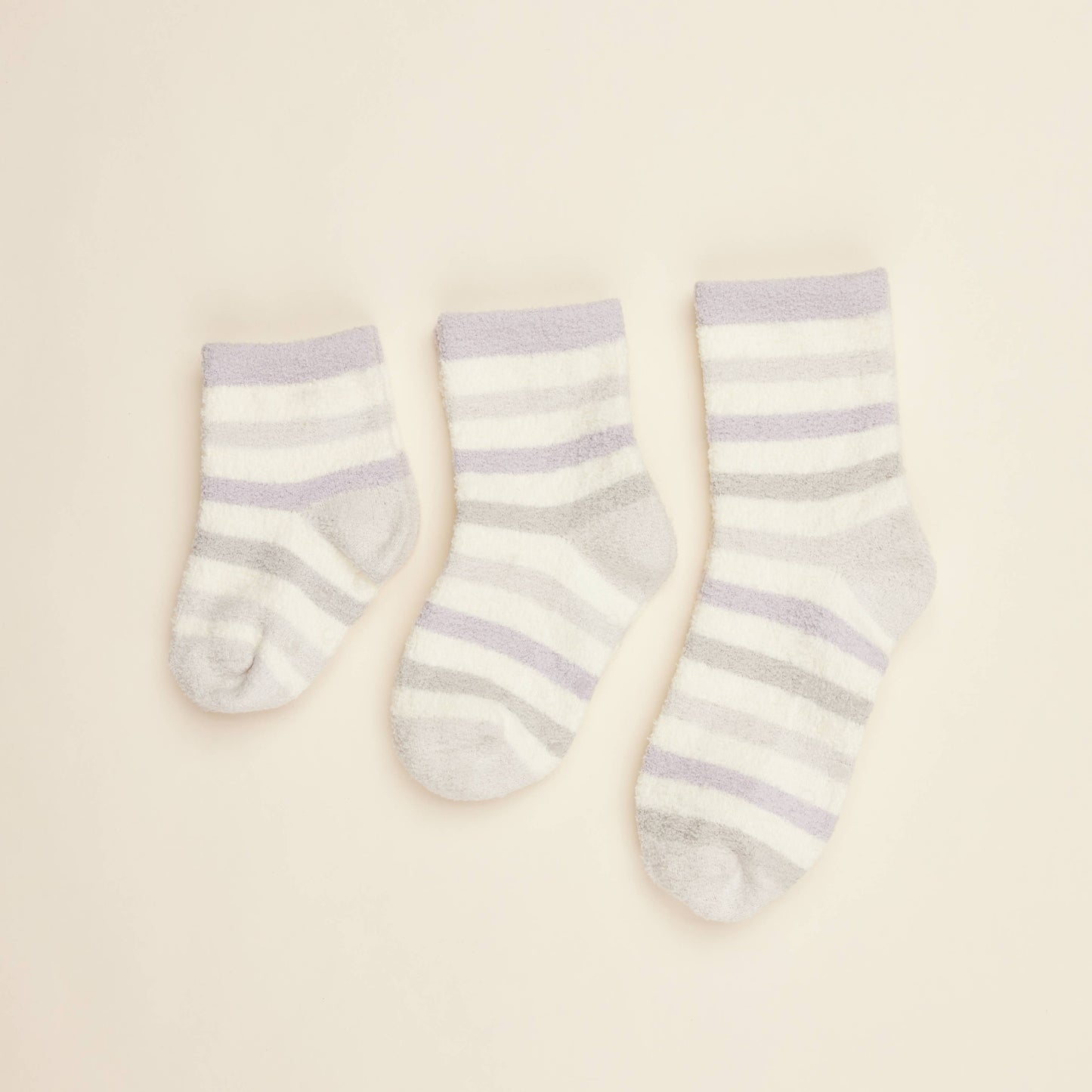Three cream crew socks with lilac horizontal stripes and small toe bear print