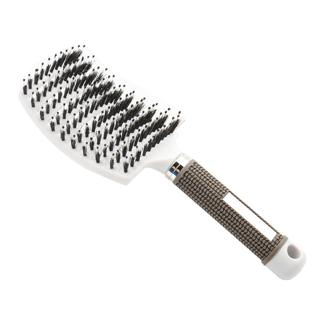 White massage hair comb with textured grip handle and dense black bristles