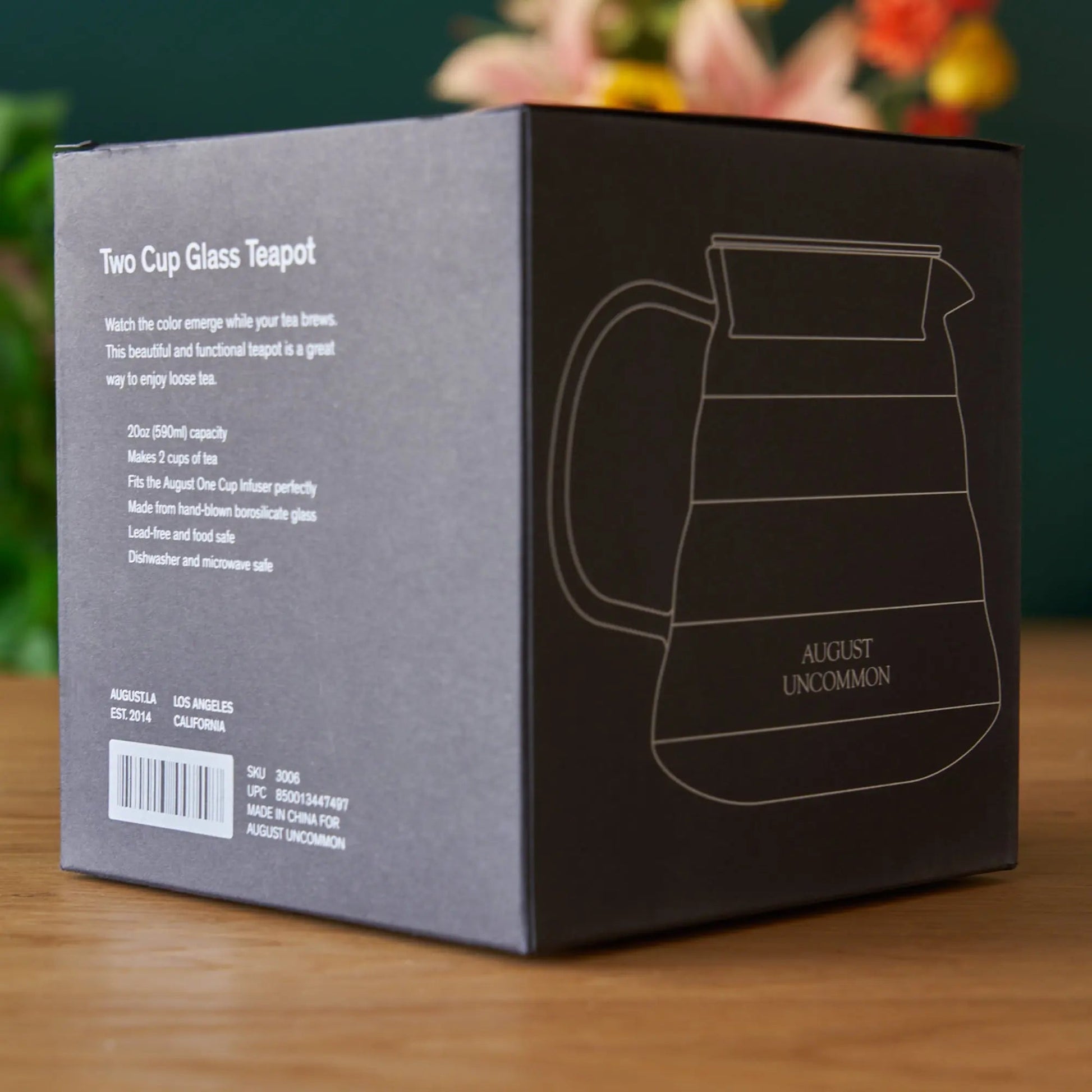 Two Cup Glass Teapot box with product diagram and August Uncommon logo.