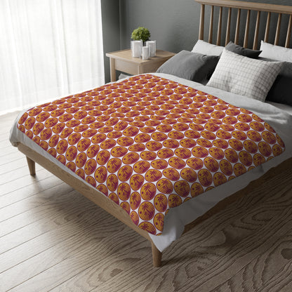 Velveteen throw blanket with repeating orange pumpkin circle print