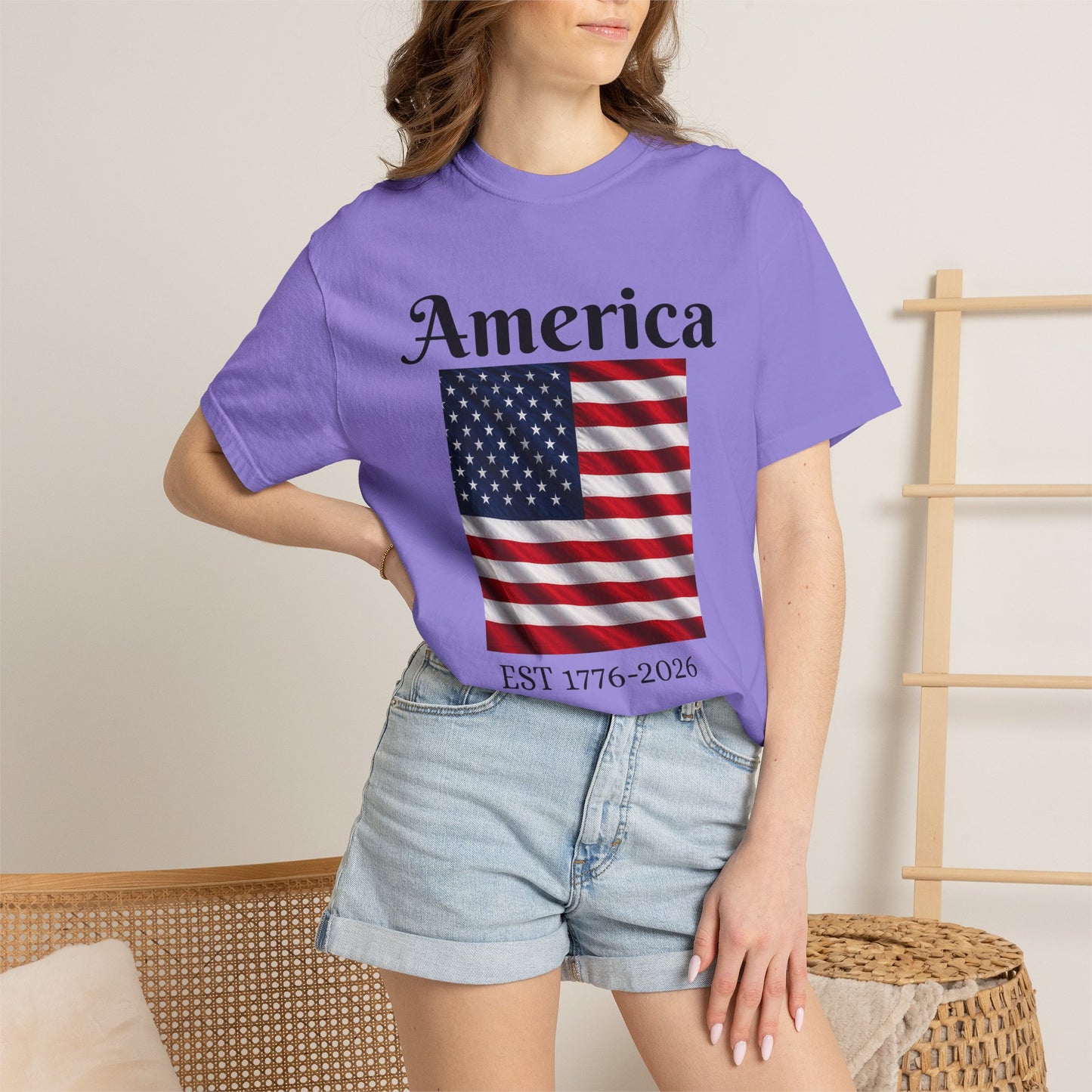 Lavender America flag graphic T-shirt with eagle and EST 1776-2026 text