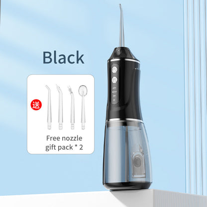 Black portable electric dental flosser with free nozzle gift pack shown