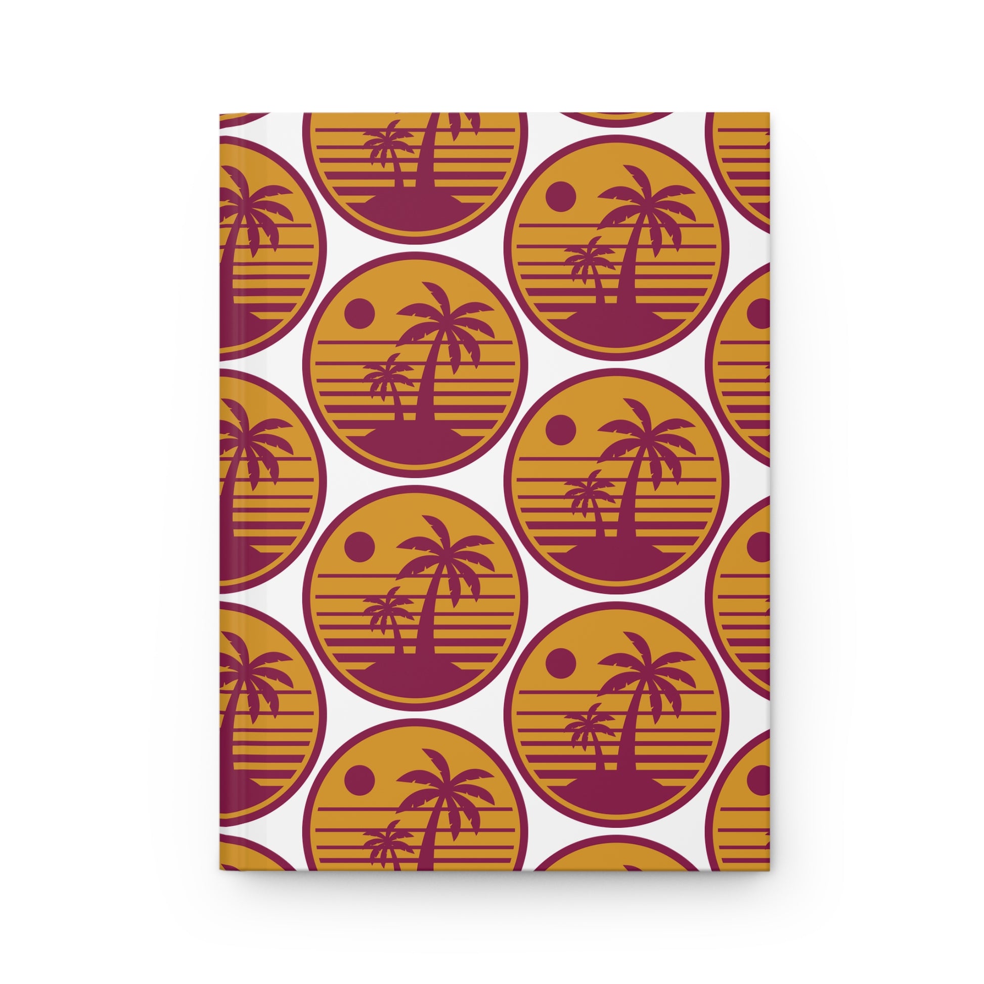 Hardcover journal with retro palm tree circle pattern in maroon and gold on white.