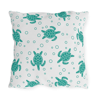 Outdoor sea turtle pillow with teal turtle prints and teal circles on white