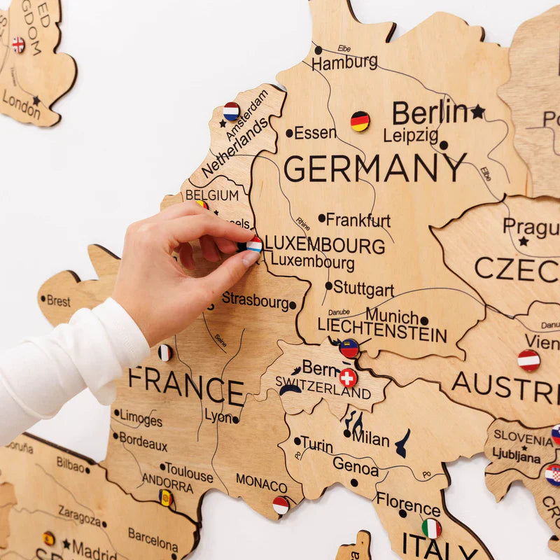 3D Europe wooden map detail showing Germany, France, and Switzerland labels