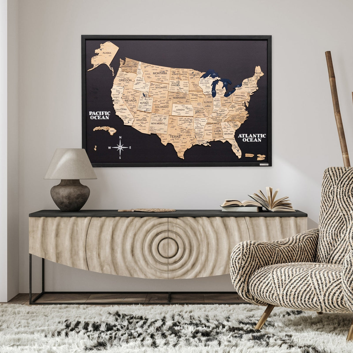 3D wooden USA map wall art on a wall above a console and rug