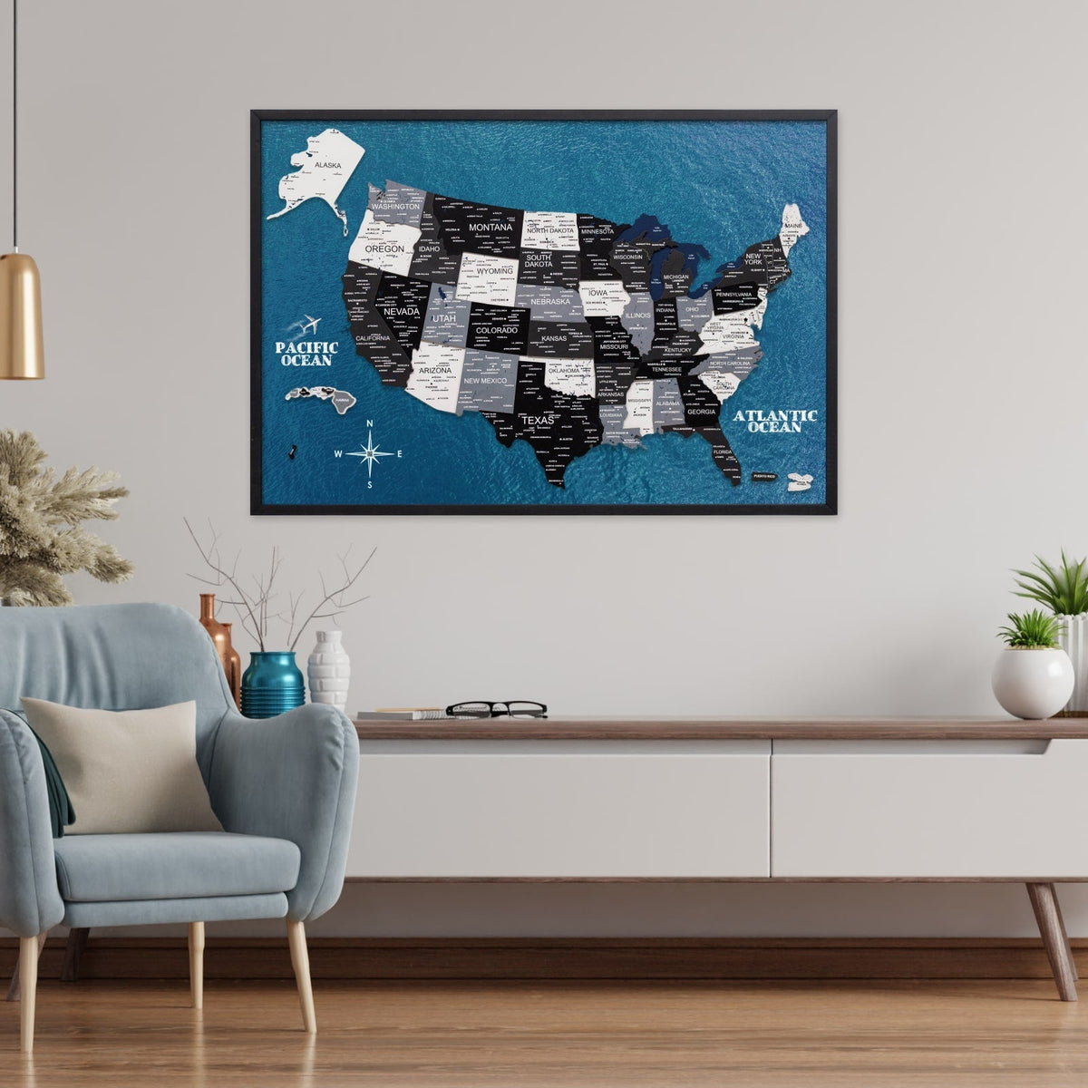 Ocean-blue USA map board in black frame with layered dark state label blocks and coasts