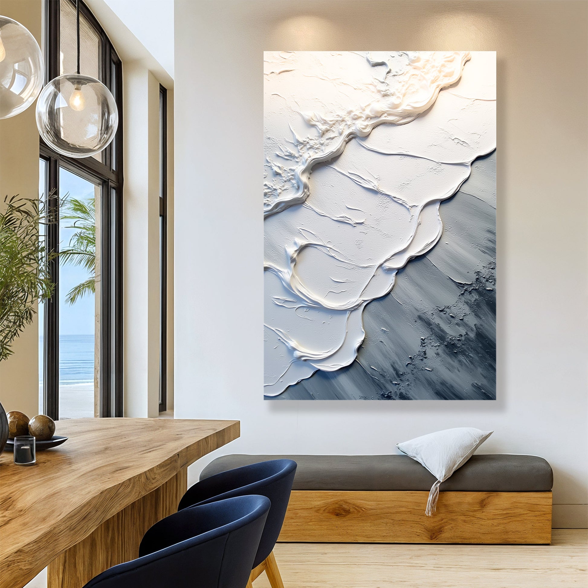 Abstract wave wall art with raised white and blue textured swirls on gray surface