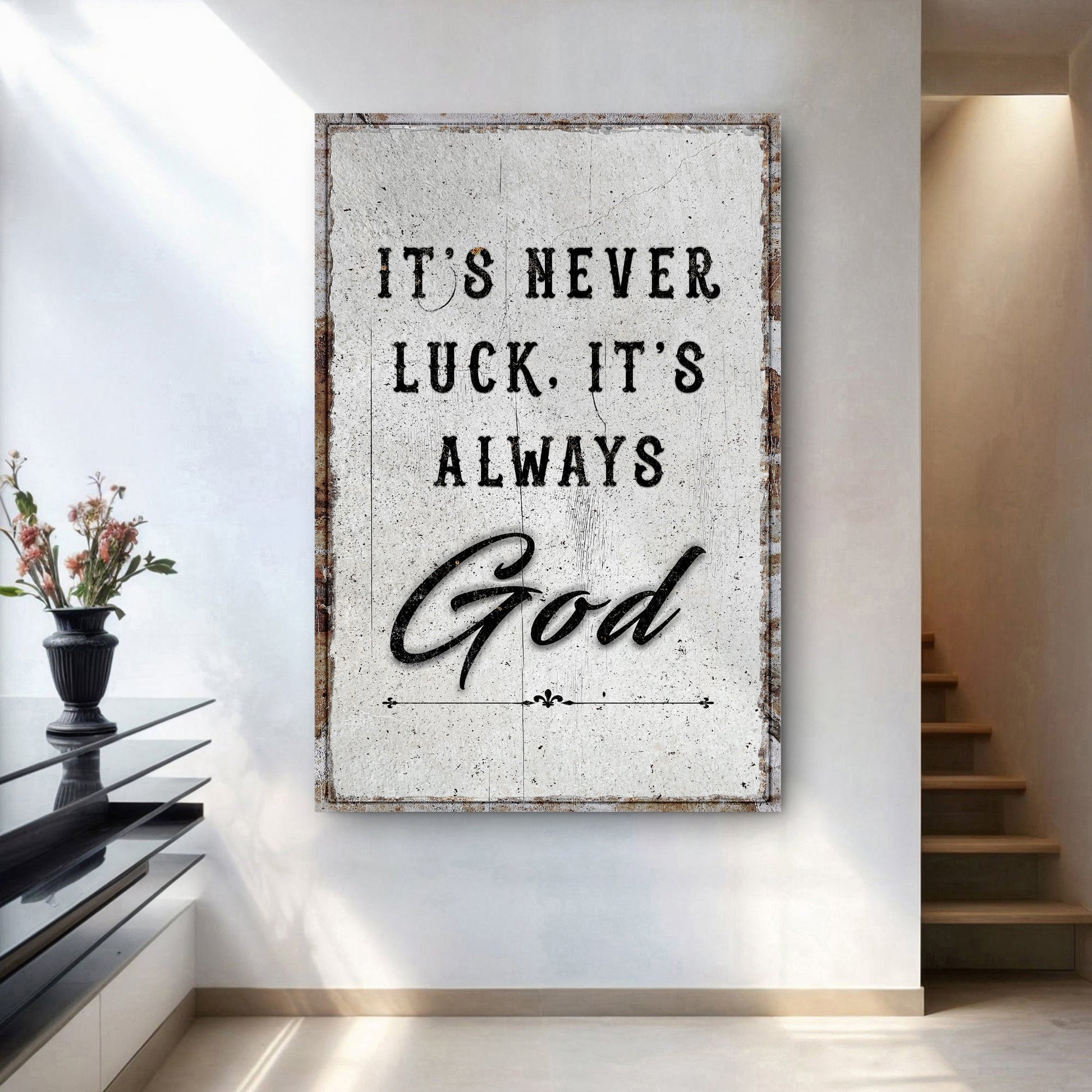Framed wall art featuring "It's never luck, it's always" and script "God" lettering