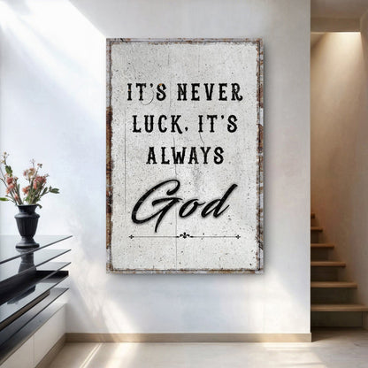 Framed wall art featuring "It's never luck, it's always" and script "God" lettering