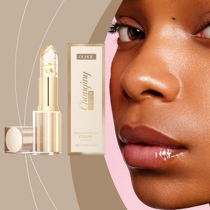 Gold color-changing nourishing lipstick; close-up lips with dark glossy berry shade