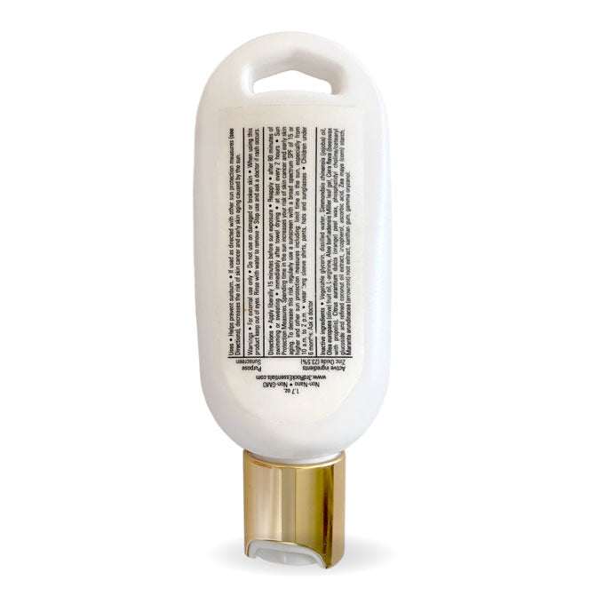 Unscented zinc oxide sunscreen lotion bottle with back label and gold cap