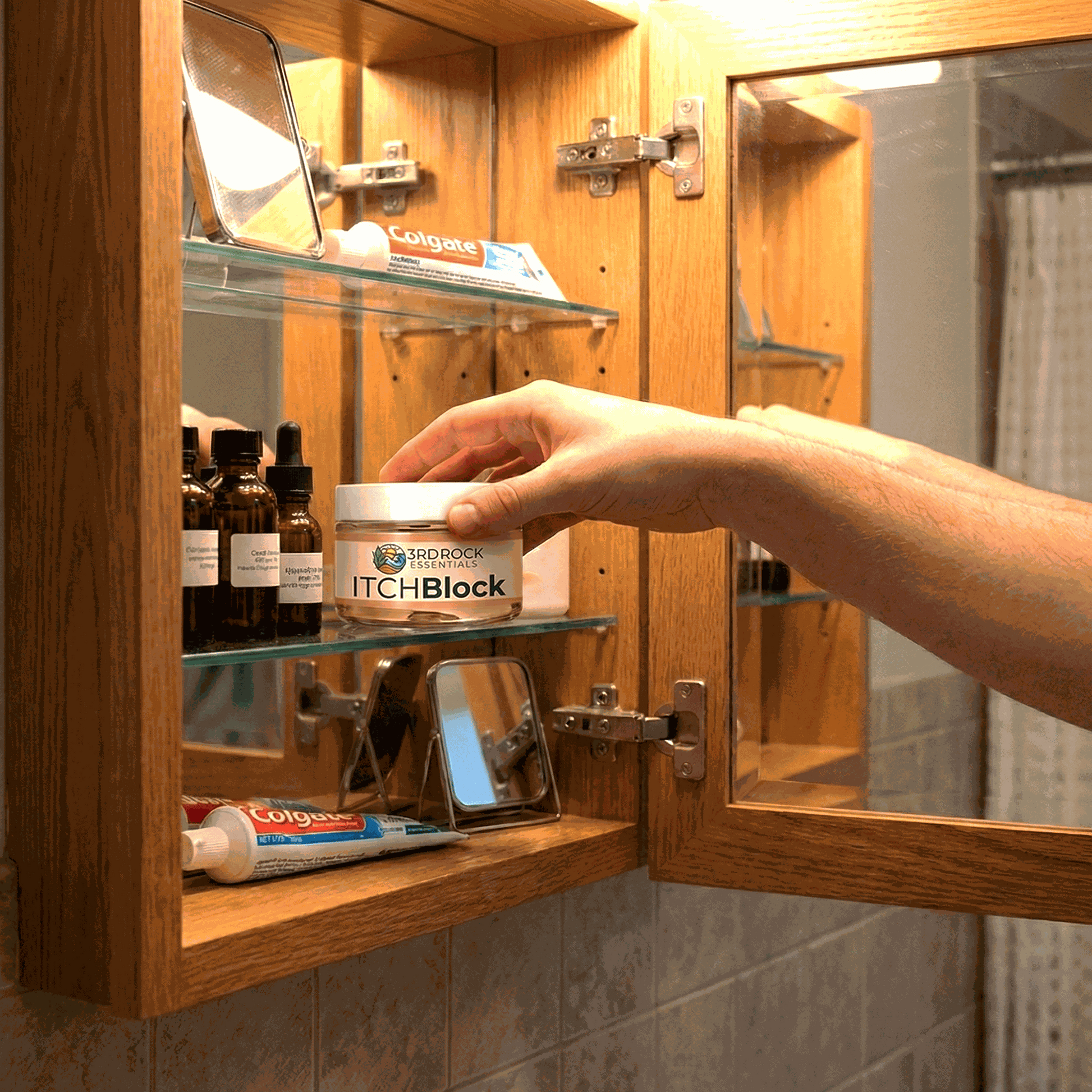Itch relief cream jar on bathroom counter with hand reaching for lid