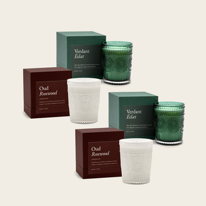 Scented glass candle set with green, dark red, and white ribbed jars and boxes
