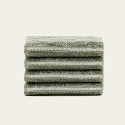 Sage green cotton towels, folded stack with horizontal stripes