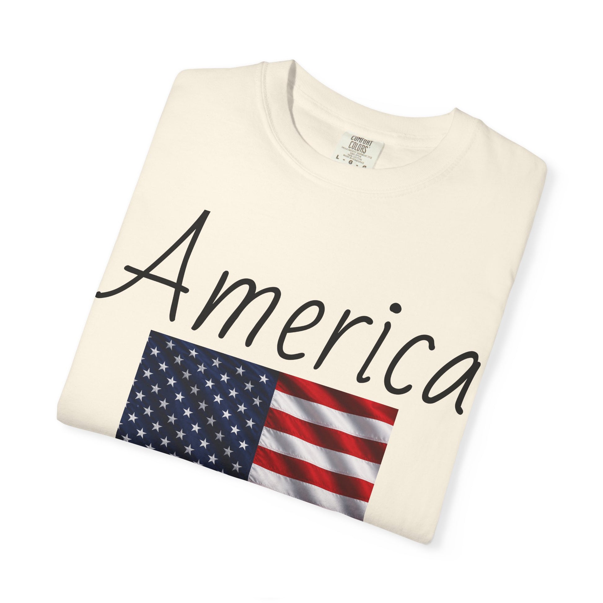 Ivory unisex t-shirt with “America” script and U.S. flag graphic