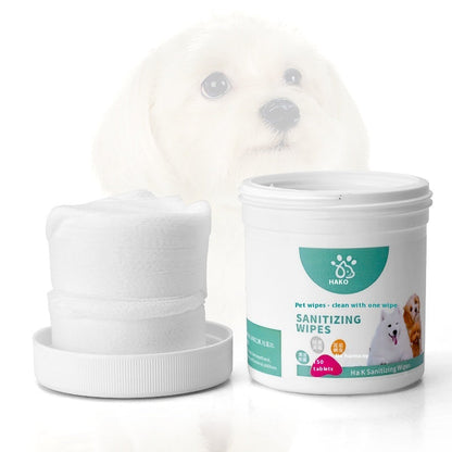 Pet sanitizing wipes canister beside folded wipes stack, white tub with teal label