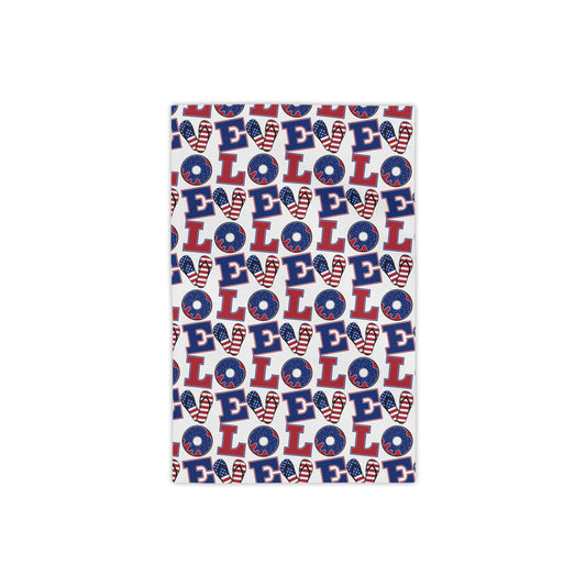 Patriotic beach towel with red, white, and blue LOLO lettering pattern