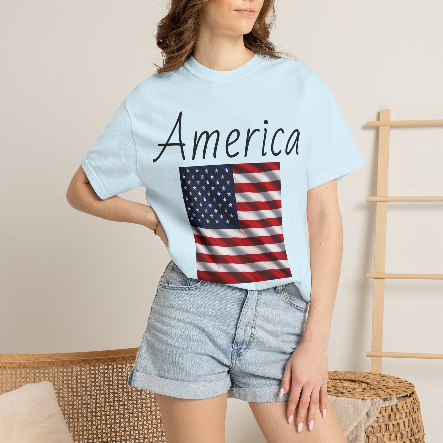 Light blue unisex T-shirt with America script and U.S. flag graphic, crew neck