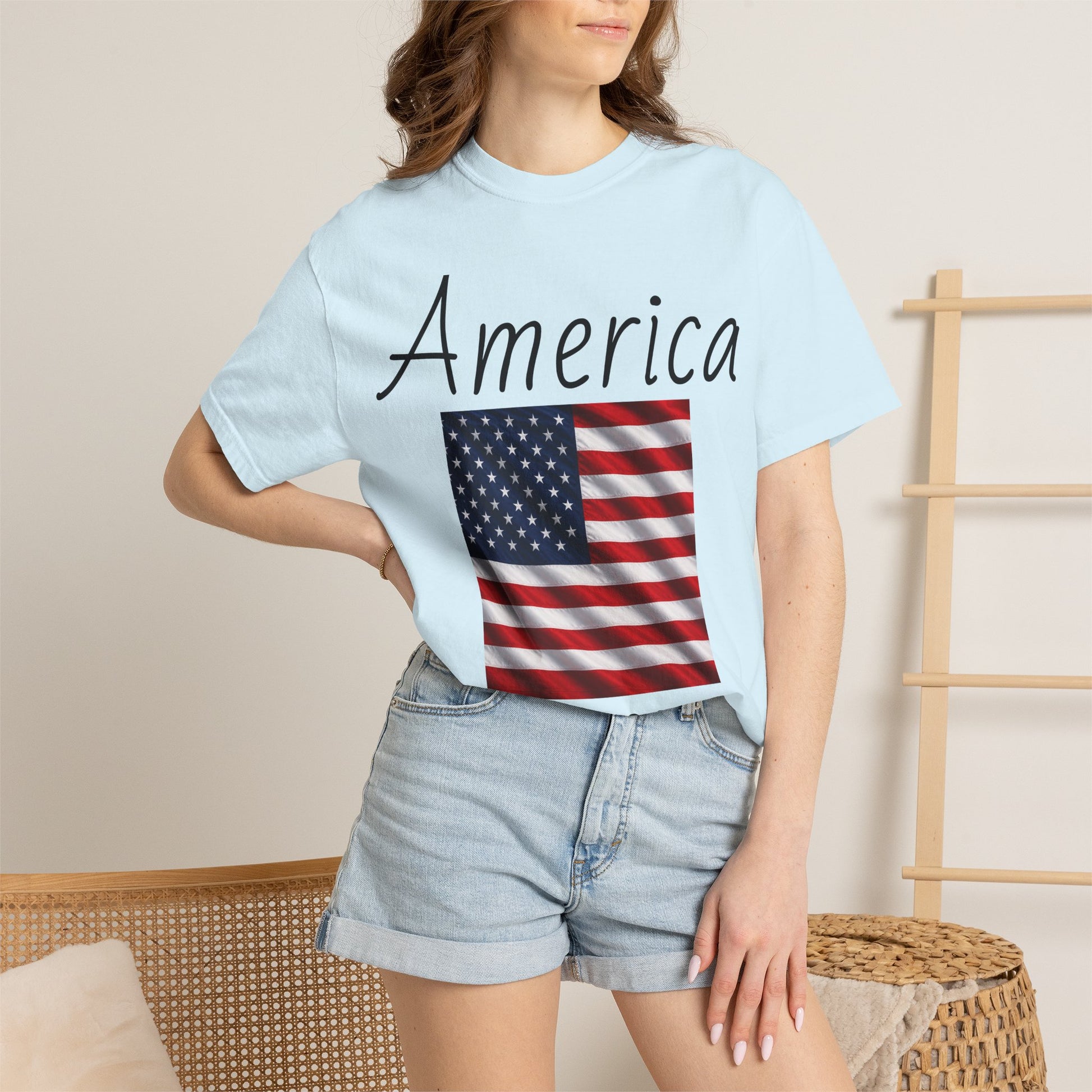 Light blue unisex T-shirt with America script and U.S. flag graphic, crew neck