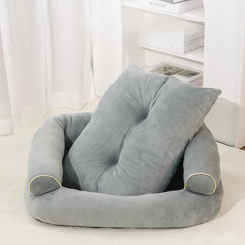 Gray pet sofa bed with cushioned base and supportive side bolsters, beige trim detail.
