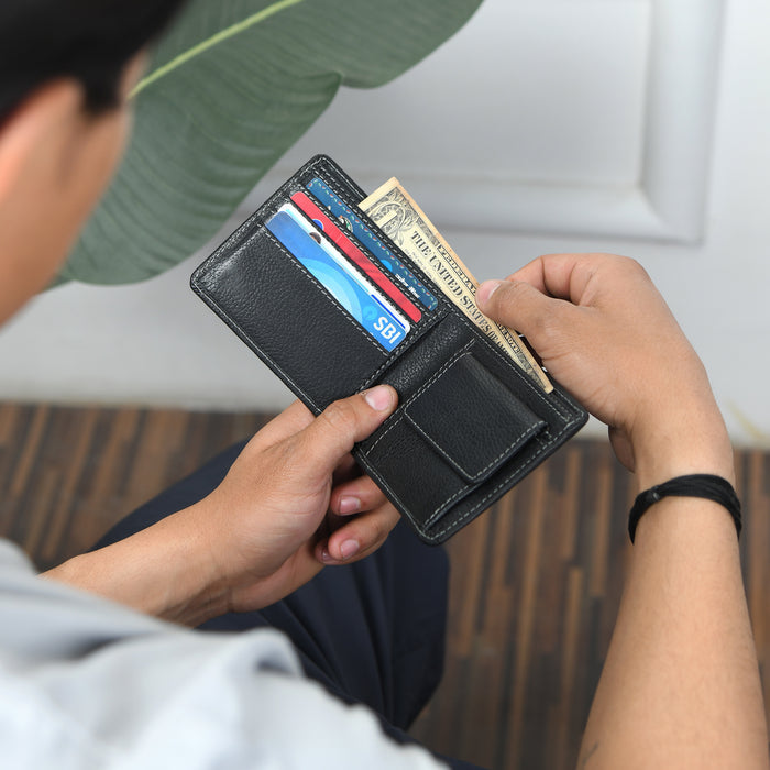 Black leather bifold wallet with card slots and fold-over flap