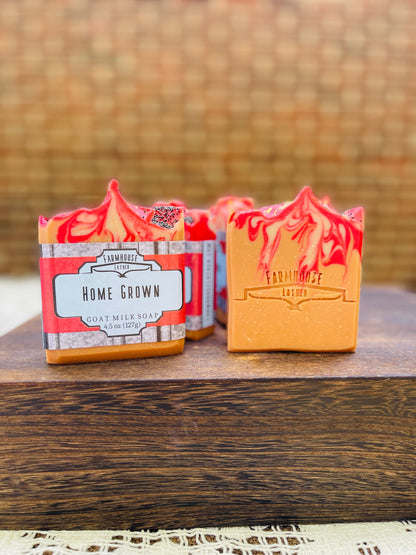 Two wrapped soap bars in boxes, one red and one yellow