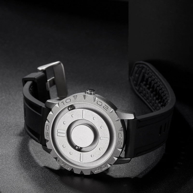 Men’s magnetic pointer watch with black rubber strap and silver-toned bezel with marker numerals