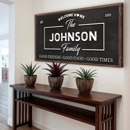 Wall sign with dark background and white “The Johnson Family” text above a long console