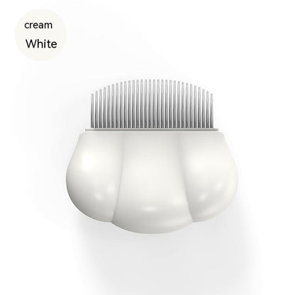 Cream white pet shell grooming comb with fine metal teeth, rounded shell body