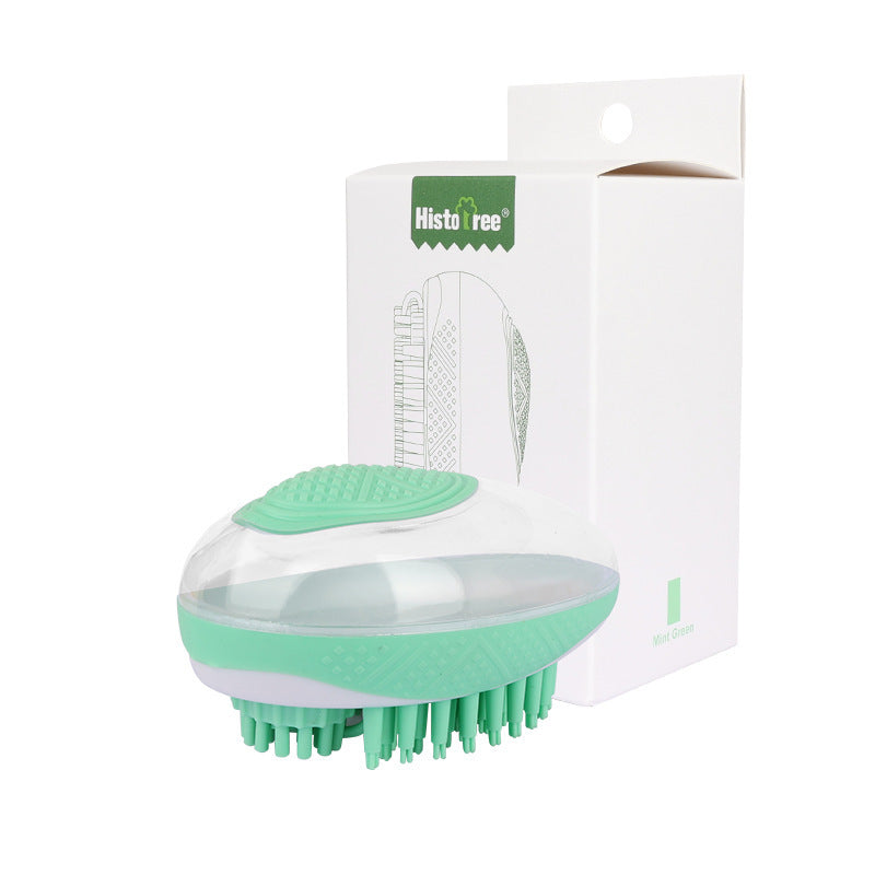 Green pet bath brush with silicone bristle pad, packaged in retail box