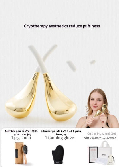Gold ice spoon facial massage device with white cord handles and cooling eye pad