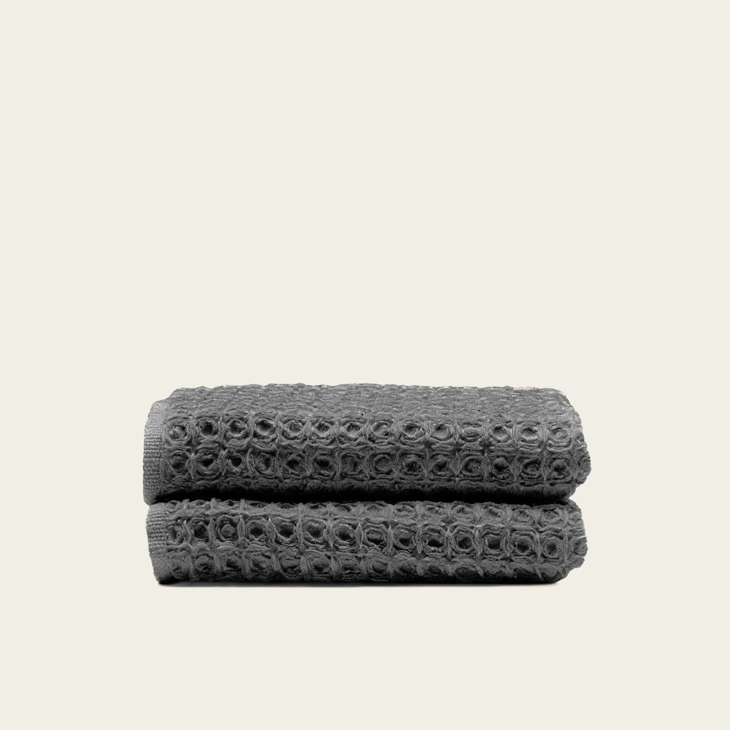 Charcoal waffle bath towel folded, showing woven waffle texture