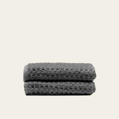 Charcoal waffle bath towel folded, showing woven waffle texture