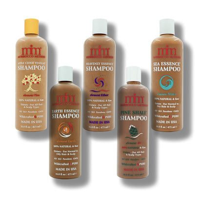 Five shampoo bottles in amber brown with gold and white caps