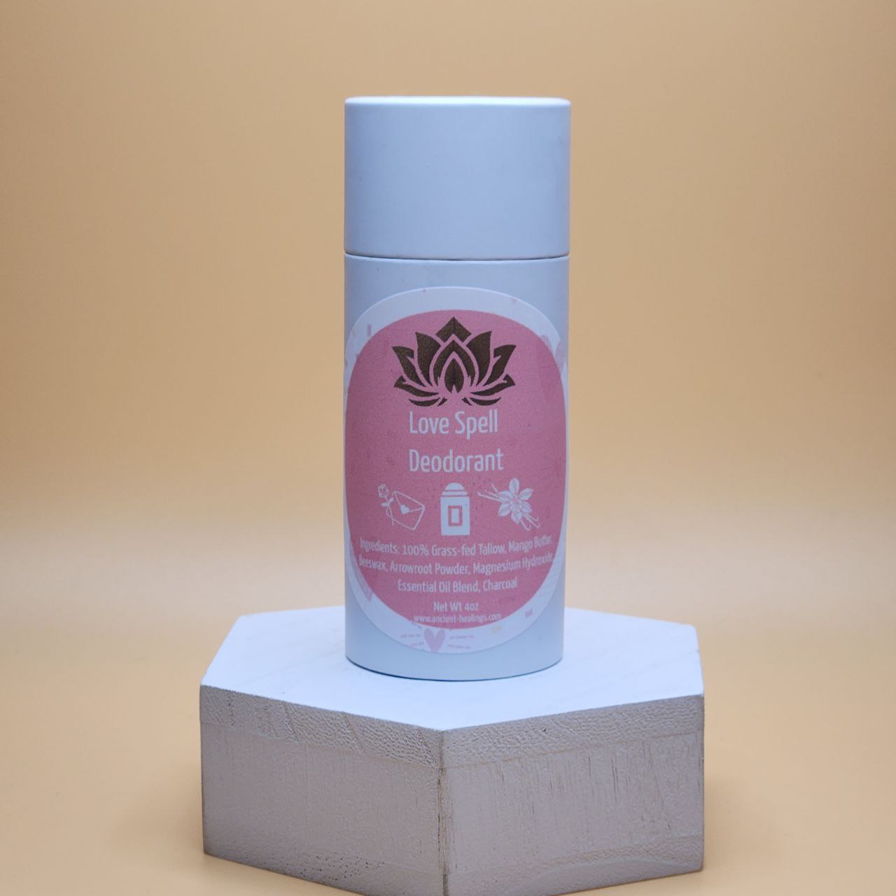 Deodorant stick with blue cap and pink Love Spell label