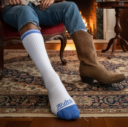 Blue-and-white ribbed socks on feet with brown boots