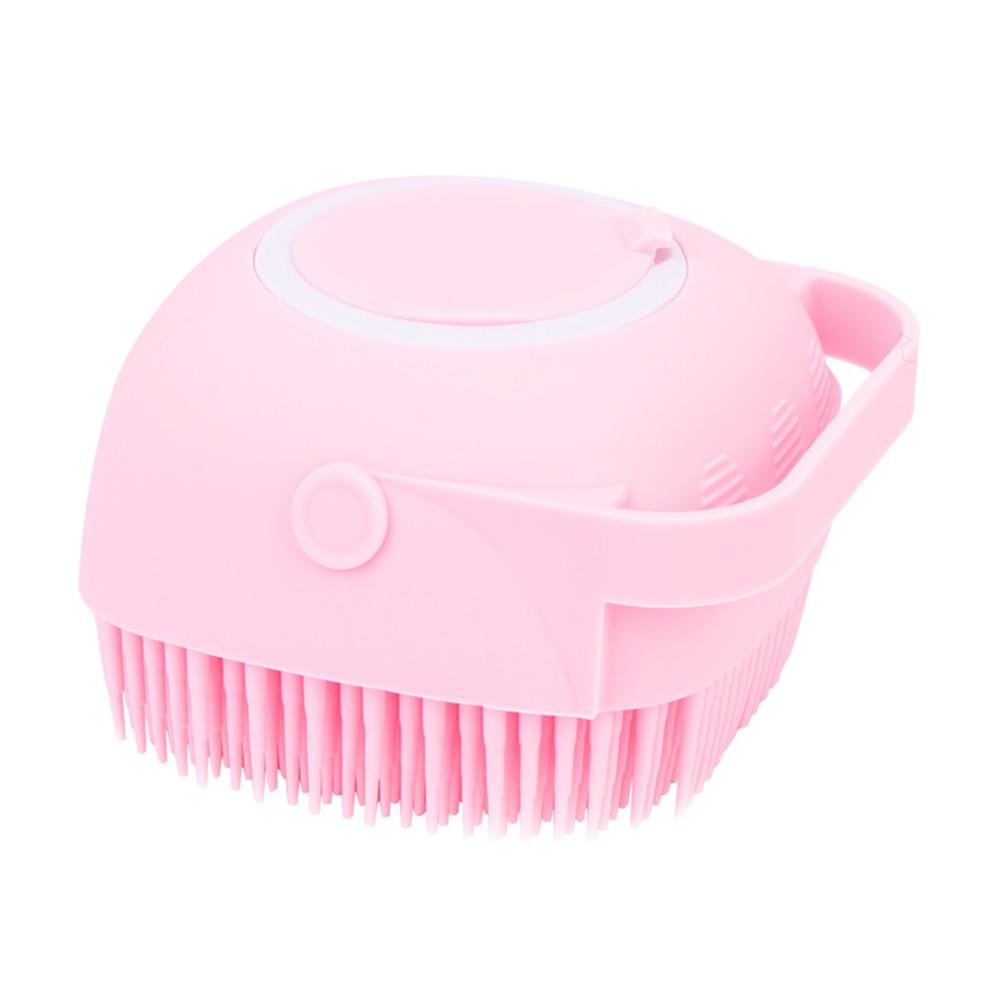 Pink dog bath brush with soft bristles and circular top opening