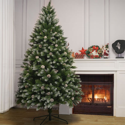 Artificial Christmas tree with snow-dusted green needles and pinecones, on stand